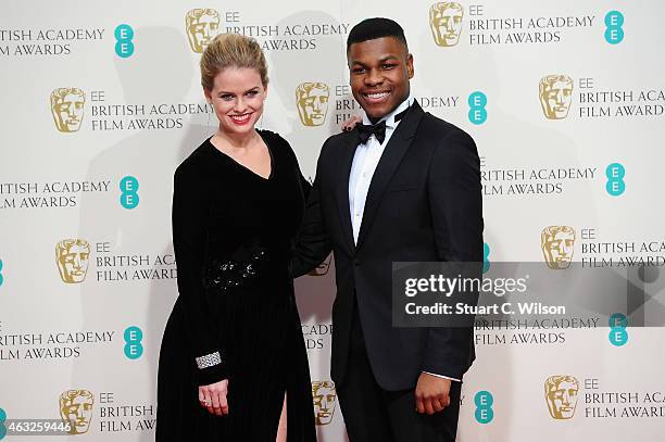 Alice Eve and John Boyega pose in the winners room at the EE British Academy Film Awards at The Royal Opera House on February 8, 2015 in London,...