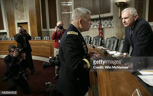 Army Gen. John Campbell , commander of the International Security Assistance Force, U.S. Forces-Afghanistan, speaks with ranking member Sen. Jack...
