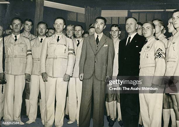 Members of the Hitler Youth pose for photographs with Japanese Prime Minister Fumimaro Konoe on August 27, 1938 in Karuizawa, Nagano, Japan.