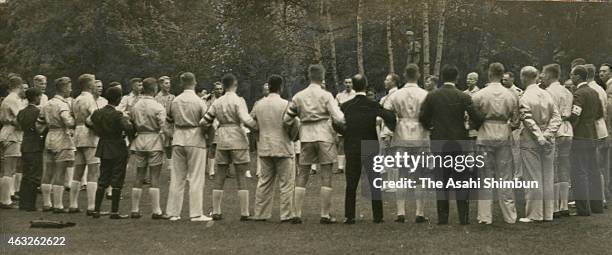 Members of the Hitler Youth form a huddle to sing a song on August 27, 1938 in Karuizawa, Nagano, Japan.