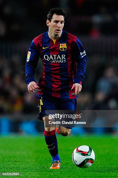 Lionel Messi of FC Barcelona runs with the ball during the Copa del Rey Semi-Final first leg match between FC Barcelona and Villarreal CF at Camp Nou...