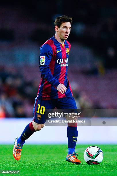 Lionel Messi of FC Barcelona runs with the ball during the Copa del Rey Semi-Final first leg match between FC Barcelona and Villarreal CF at Camp Nou...