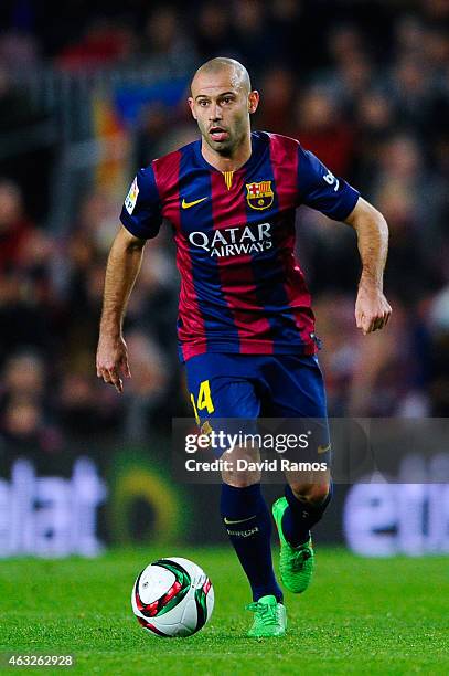 Javier Mascherano of FC Barcelona runs with the ball during the Copa del Rey Semi-Final first leg match between FC Barcelona and Villarreal CF at...