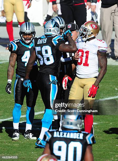 Thomas Davis of the Carolina Panthers has to be separated from Anquan Boldin of the San Francisco 49ers during the NFC Divisional Playoff Game at...