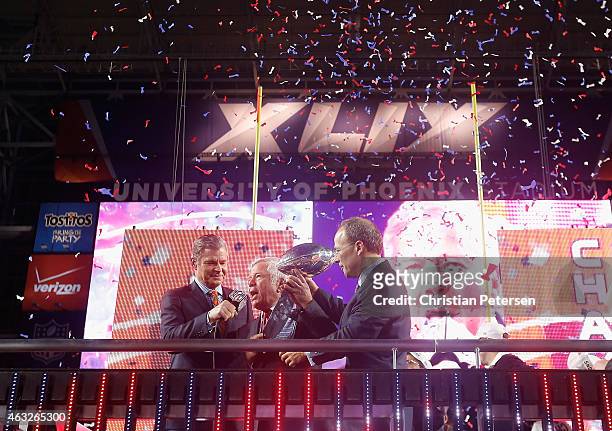 New England Patriots Owner Robert Kraft and son Jonathan Kraft celebrate with the Vince Lombardi Trophy, alongside NFL Network's Dan Patrick , after...