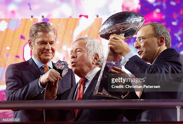 New England Patriots Owner Robert Kraft and son Jonathan Kraft celebrate with the Vince Lombardi Trophy, alongside NFL Network's Dan Patrick , after...