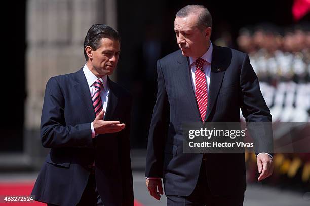 Recep Tayyip Erdogan president of Turkey walks next to Enrique Pena Nieto president of Mexico upon he arrives at Palacio Nacional for a meeting...