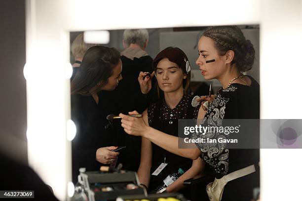 Model is getting styled backstage ahead of the Marina Hoermanseder show during Mercedes-Benz Fashion Week Autumn/Winter 2014/15 at Brandenburg Gate...