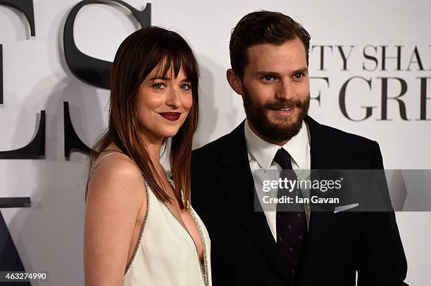 Dakota Johnson and Jamie Dornan attend the UK Premiere of "Fifty Shades Of Grey" at Odeon Leicester Square on February 12, 2015 in London, England.