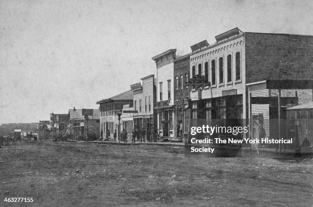 View of buildings, in a small frontier town on the Plains, during America's westward expansion era, nineteenth century.