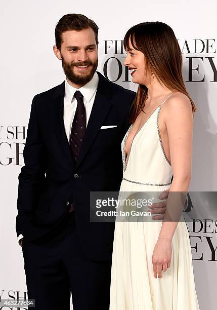 Dakota Johnson and Jamie Dornan attend the UK Premiere of "Fifty Shades Of Grey" at Odeon Leicester Square on February 12, 2015 in London, England.