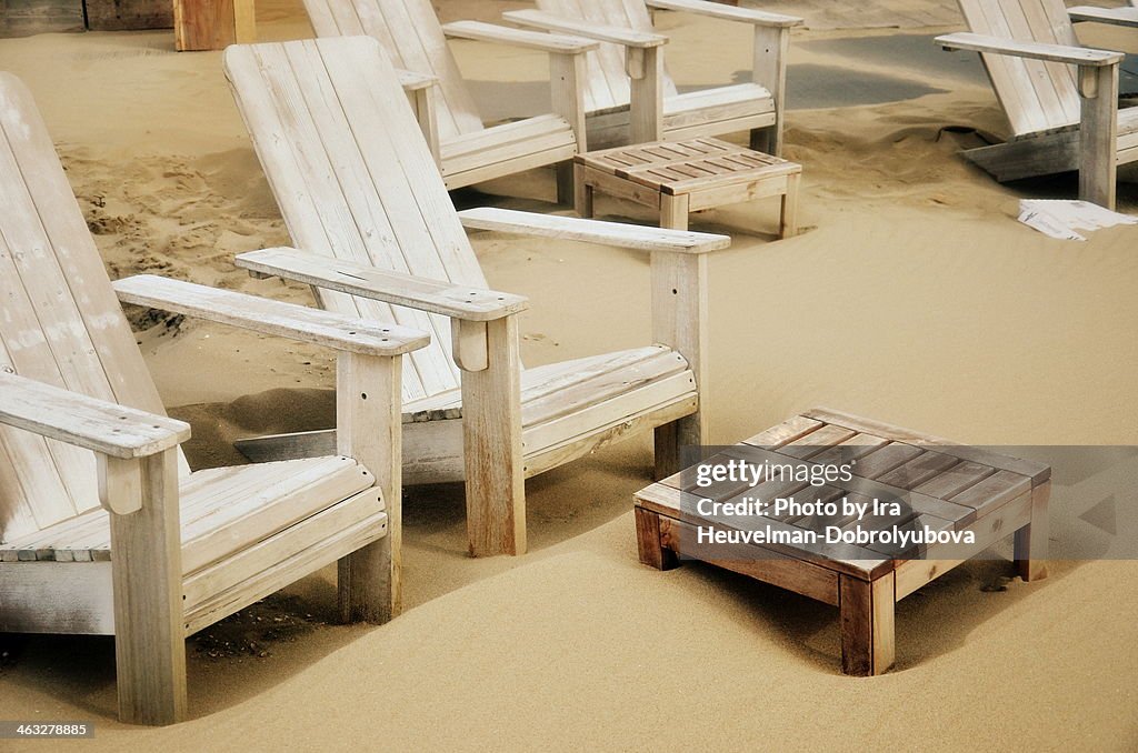 Empty wooden beach chairs