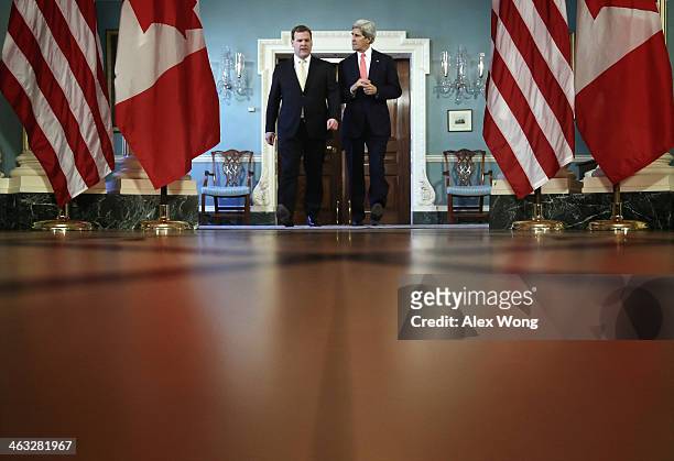 Secretary of State John Kerry and Canadian Foreign Minister John Baird come out to speak to the press prior to a bilateral meeting January 17, 2014...