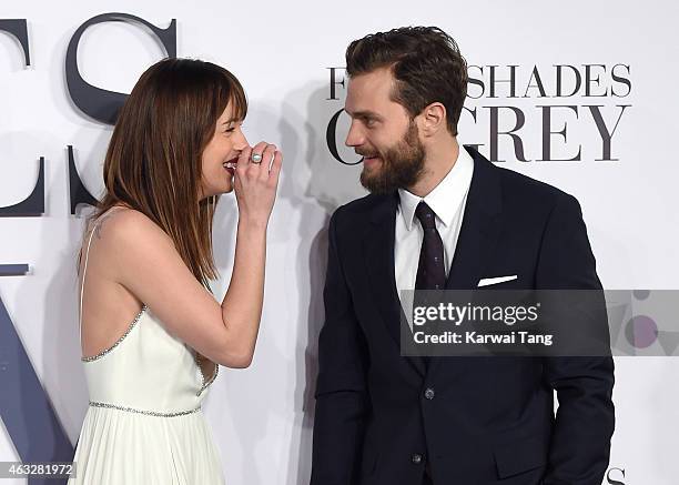 Dakota Johnson and Jamie Dornan attend the UK Premiere of "Fifty Shades Of Grey" at Odeon Leicester Square on February 12, 2015 in London, England.