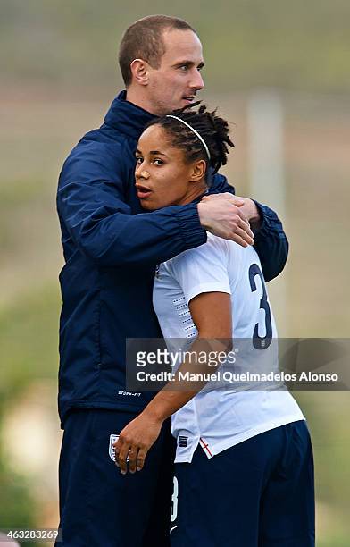 Head coach Mark Sampson of England embraces Demi Stokes during the friendly match between England and Norway at la Manga Club on January 17, 2014 in...