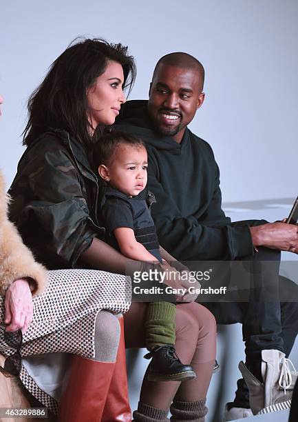 Kim Kardashian, North West and Kanye West attend the adidas show during Mercedes-Benz Fashion Week Fall 2015 at Skylight Clarkson SQ. On February 12,...