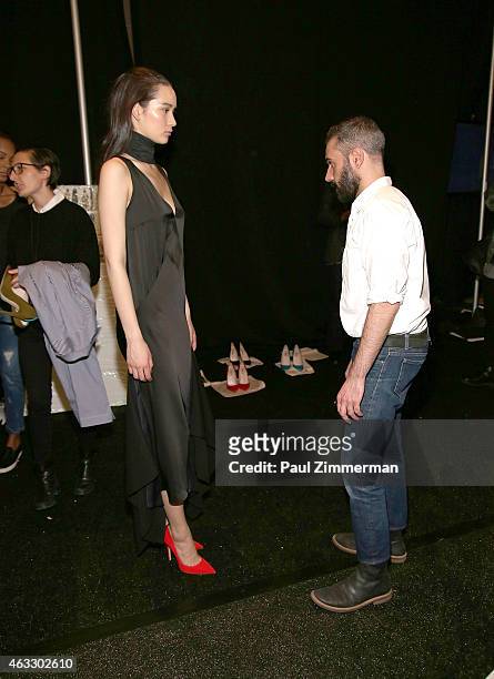 Tome designer Ramon Martin and a model backstage at Tome show during Mercedes-Benz Fashion Week Fall 2015 at The Pavilion at Lincoln Center on...