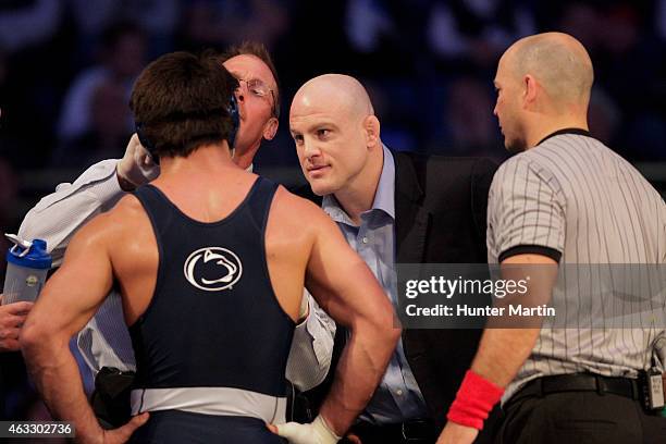 Head coach Cael Sanderson of the Penn State Nittany Lions coaches during a match against the Iowa Hawkeyes on February 8, 2015 at the Bryce Jordan...