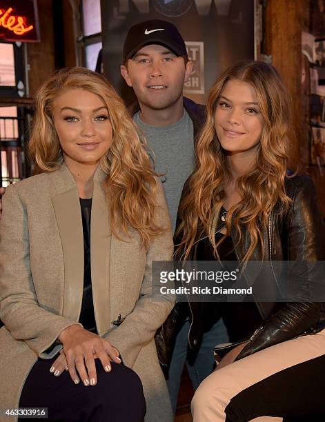 Swimsuit models Gigi Hadid and Nina Agdal are joined by Singer/Songwriter Scotty McCreery during "SI NOW" at Tootsie's Orchid Lounge on February 12,...