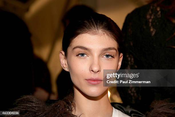 Model prepares backstage at the Tome show during Mercedes-Benz Fashion Week Fall 2015 at The Pavilion at Lincoln Center on February 12, 2015 in New...