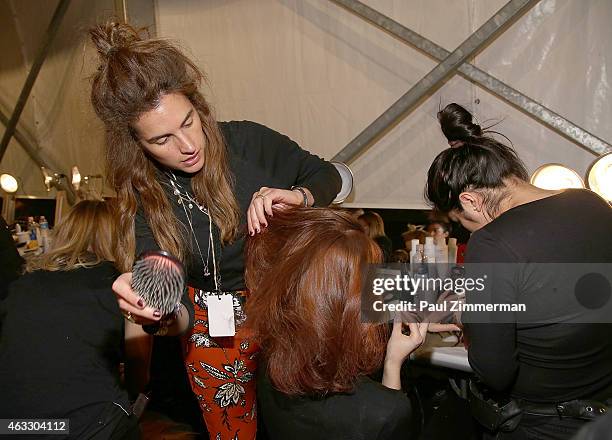 Model prepares backstage at the Tome show during Mercedes-Benz Fashion Week Fall 2015 at The Pavilion at Lincoln Center on February 12, 2015 in New...