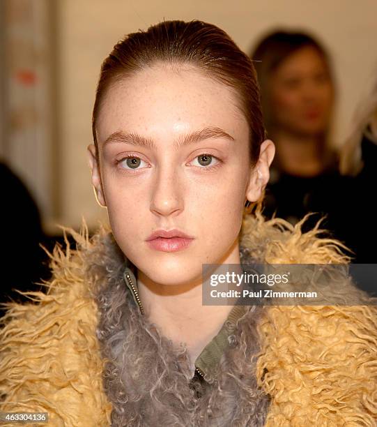 Model prepares backstage at the Tome show during Mercedes-Benz Fashion Week Fall 2015 at The Pavilion at Lincoln Center on February 12, 2015 in New...