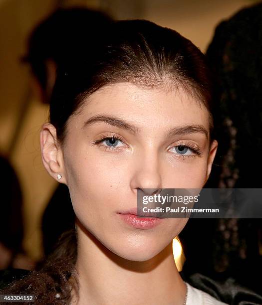 Model prepares backstage at the Tome show during Mercedes-Benz Fashion Week Fall 2015 at The Pavilion at Lincoln Center on February 12, 2015 in New...