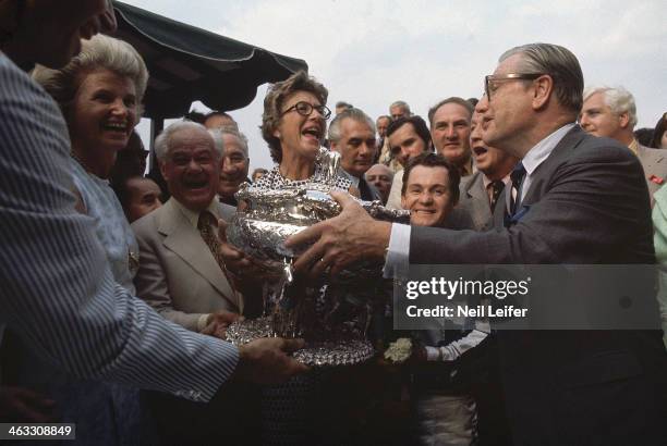 Belmont Stakes: Secretariat owner Helen "Penny" Chenery Tweedy and trainer Lucien Laurin victorious, receiving trophy from New York Governor Nelson...