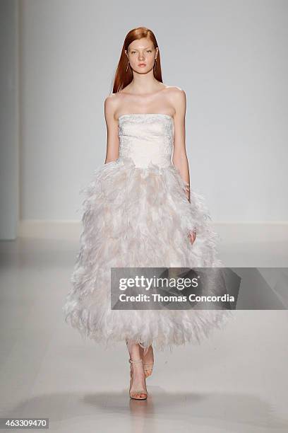 Model walks the runway at the Tadashi Shoji show during Mercedes-Benz Fashion Week Fall 2015 at The Salon at Lincoln Center on February 12, 2015 in...