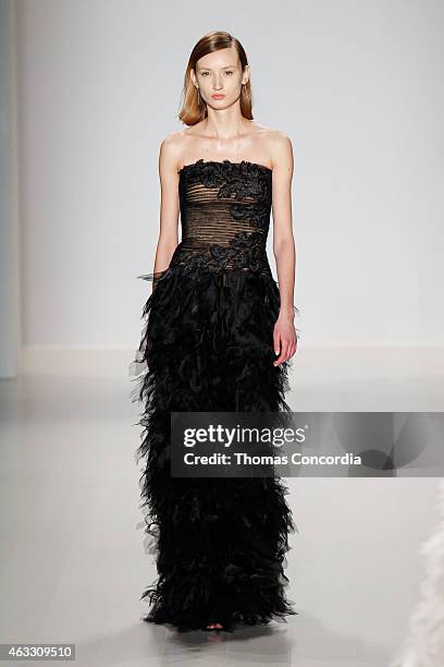 Model walks the runway at the Tadashi Shoji show during Mercedes-Benz Fashion Week Fall 2015 at The Salon at Lincoln Center on February 12, 2015 in...