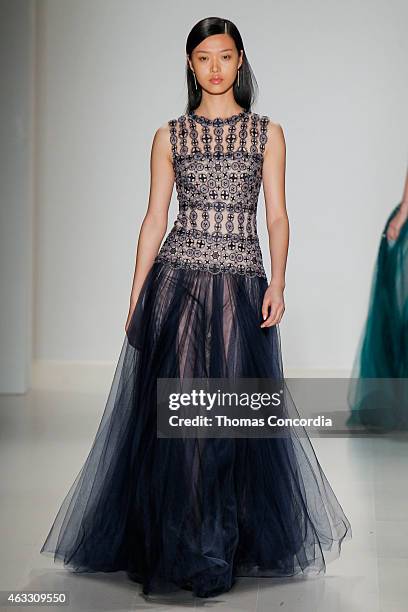 Model walks the runway at the Tadashi Shoji show during Mercedes-Benz Fashion Week Fall 2015 at The Salon at Lincoln Center on February 12, 2015 in...