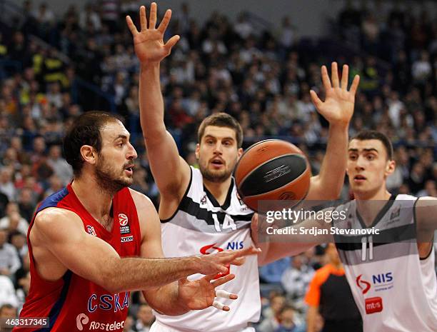 Nenad Krstic of CSKA Moscow in action against Djordje Gagic and Nikola Milutinov of Partizan Belgrade during the 2013-2014 Turkish Airlines...