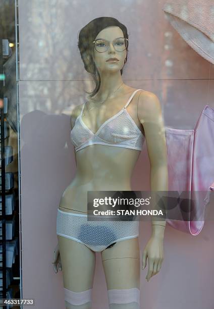 Mannequin with pubic hair is displayed in the window of an American Apparel shop on Houston Street in the Soho section of Manhattan January 17, 2014...