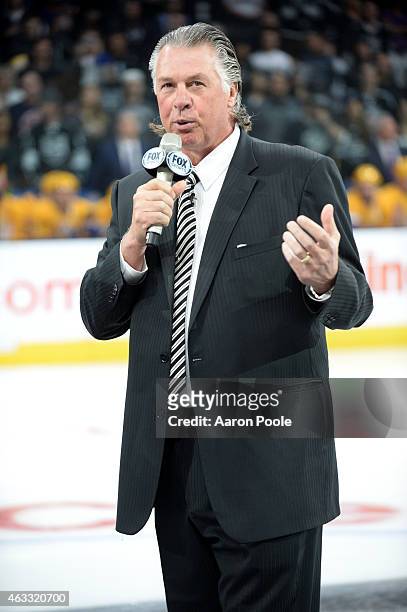 Former Head Coach and Los Angeles Kings legend Barry Melrose addresses the crowd as part of legends night before a game between the Los Angeles Kings...