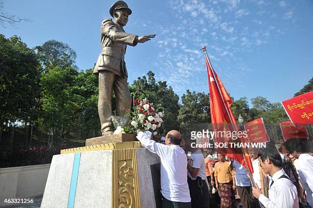 Members of the National League for Democracy party lay a wreath in front of the late General Aung San statue to mark the 100th birthday of...