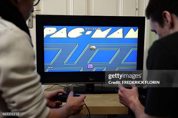 Students from the Ludus Academy play with the arcade video game Pac-Man in Strasbourg, eastern France, on February 12, 2015. In France, hundreds of...