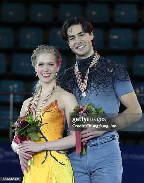 First place winner Kaitlyn Weaver and Andrew Poje of Canada pose on the podium after the medals ceremony of the Ice Dance on day two of the ISU Four...