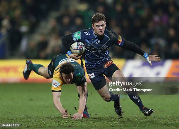Glenn Dickson of Northampton Saints tangles with Rory Kockott of Castres Olympique during the Heineken Cup pool 1 match at Franklin's Gardens on...