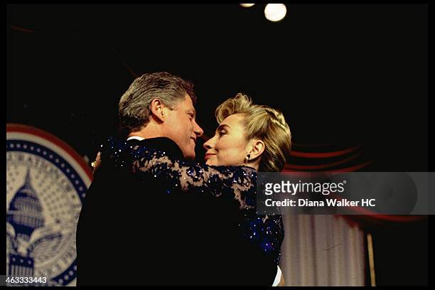 Washington, DC President Bill and Hillary Rodham Clinton are photographed dancing cheek-to-cheek, onstage at Kennedy Ctr. Inaugural ball for Time &...