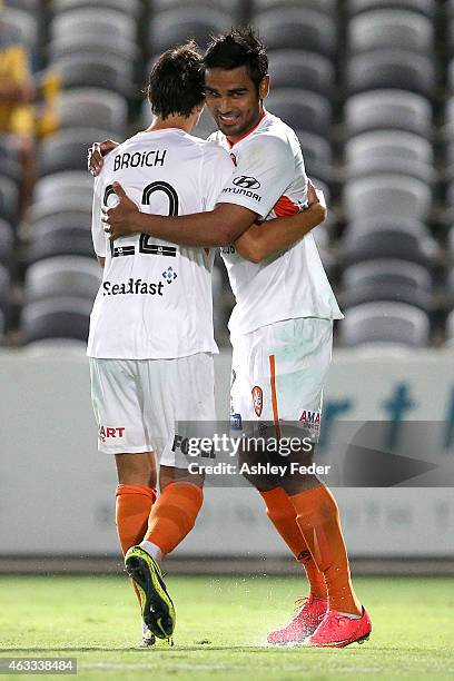 Jean Carlos Solorzano celebrates a goal with Thomas Broich of the Roar during the round 17 A-League match between the Central Coast Mariners and the...