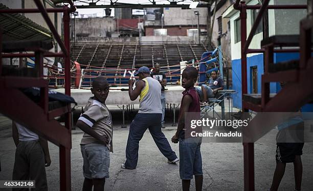 Year old Alberto Gonzales , working as a coach for 25 years, trains the kids near boxing ring at a training hall in Havana capital of Cuba on...