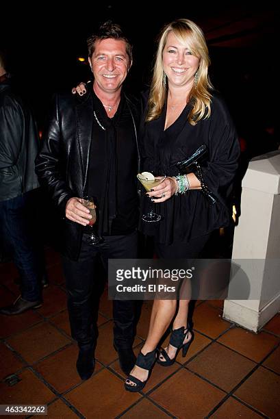 Wayne Cooper and wife Sarah Marsh poses at Hugos during the Grey Goose retrospective on August 4, 2011 in Sydney, Australia.