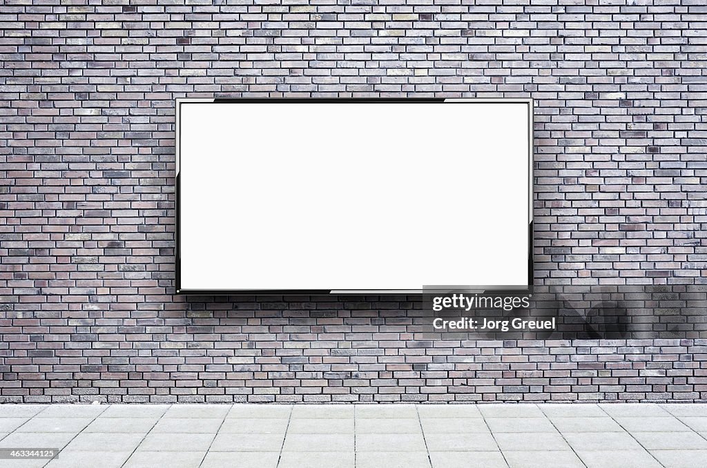 Flat screen hanging on a wall