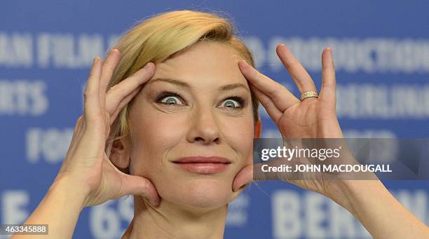 Australian actress Cate Blanchett gestures as she attends a press conference for the film "Cinderella" presented in competition of the 65th Berlin...