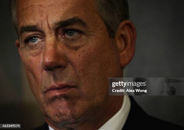 Speaker of the House John Boehner listens during a signing ceremony of the Keystone XL Pipeline Approval Act in the Rayburn Room of the Capitol...