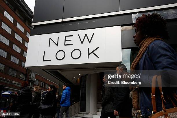 Pedestrians walk past a New Look fashion store, operated by New Look Group Ltd., on Oxford Street in London, U.K., on Friday, Feb. 13, 2015. Apax...