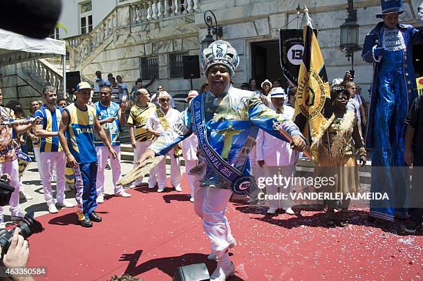 Carnival King Momo, Wilson Dias da Costa Neto dances upon receiving the keys to the city from from Rio's mayor Eduardo Paes during the official...