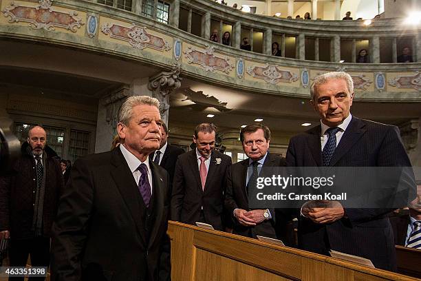 German President Joachim Gauck passes Stanislaw Tillich , Governor of Saxony, at the beginning of a ceremony in Frauenkirche during the commemoration...