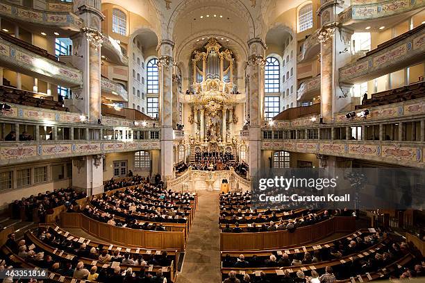 Members of the congregation attend a ceremony in Frauenkirche during the commemoration of the 70th anniversary of the Allied firebombing of Dresden...