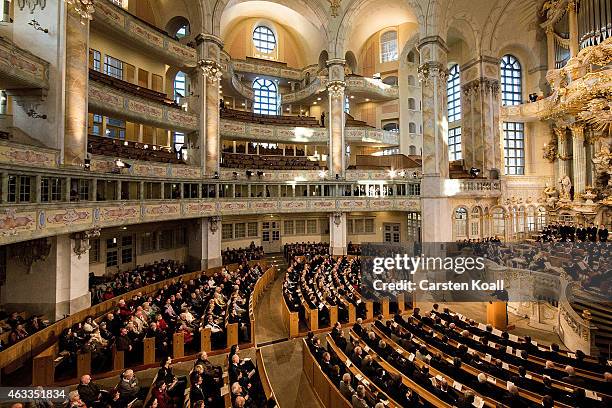 Members of the congregation attend a ceremony in Frauenkirche during the commemoration of the 70th anniversary of the Allied firebombing of Dresden...